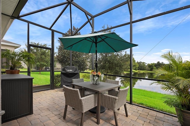 sunroom / solarium with a water view