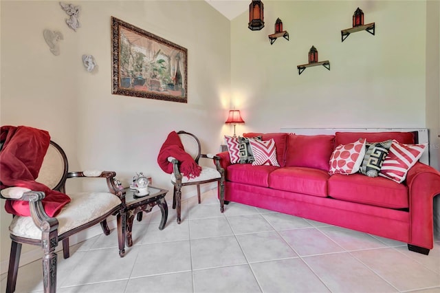 living room featuring lofted ceiling and tile patterned floors