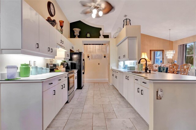 kitchen with vaulted ceiling, sink, and white cabinets