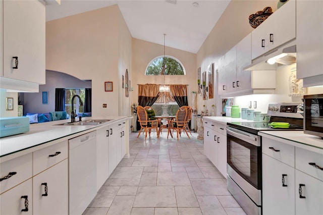 kitchen featuring white cabinets, appliances with stainless steel finishes, hanging light fixtures, and sink