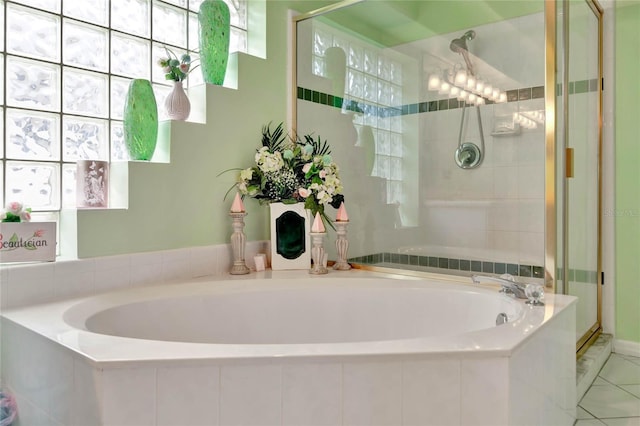 bathroom with plus walk in shower and tile patterned floors