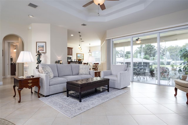 living room with light tile patterned floors and ceiling fan