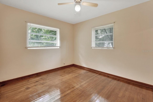 unfurnished room featuring ceiling fan and hardwood / wood-style floors