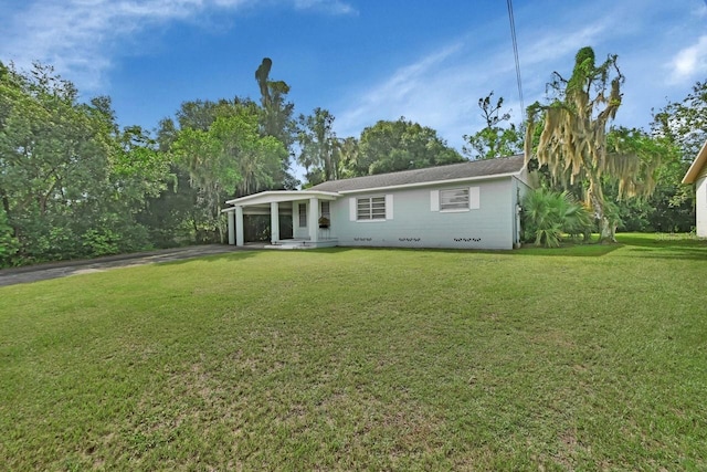 rear view of house with a yard