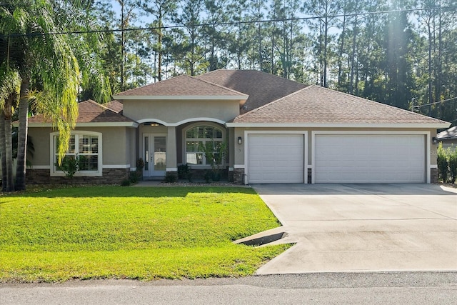 view of front facade featuring a front yard and a garage