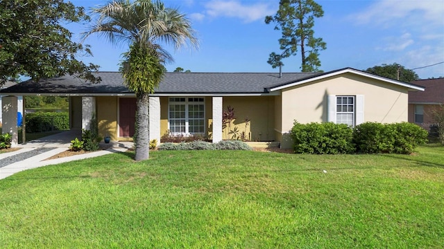 ranch-style home with a carport and a front lawn