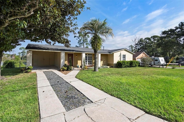 ranch-style house with a carport and a front lawn