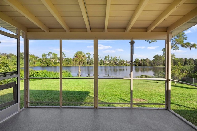 unfurnished sunroom with beamed ceiling, a water view, and wooden ceiling