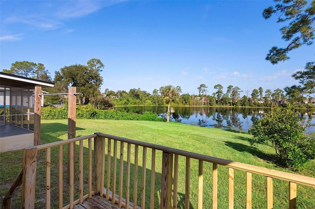 exterior space featuring a yard and a water view