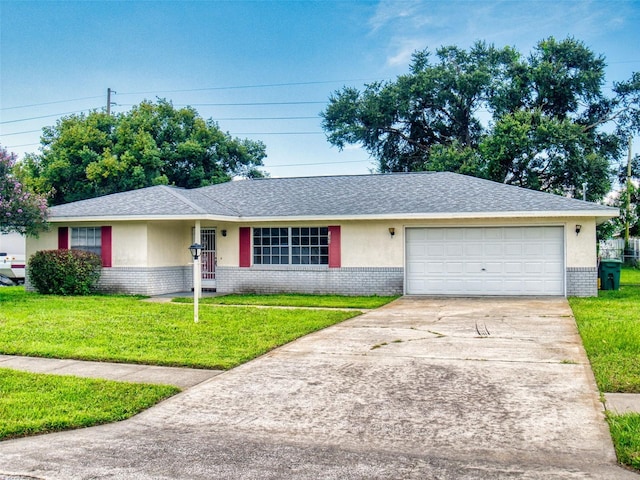 single story home featuring a front lawn and a garage