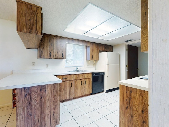 kitchen with white refrigerator, light tile patterned floors, sink, kitchen peninsula, and black dishwasher