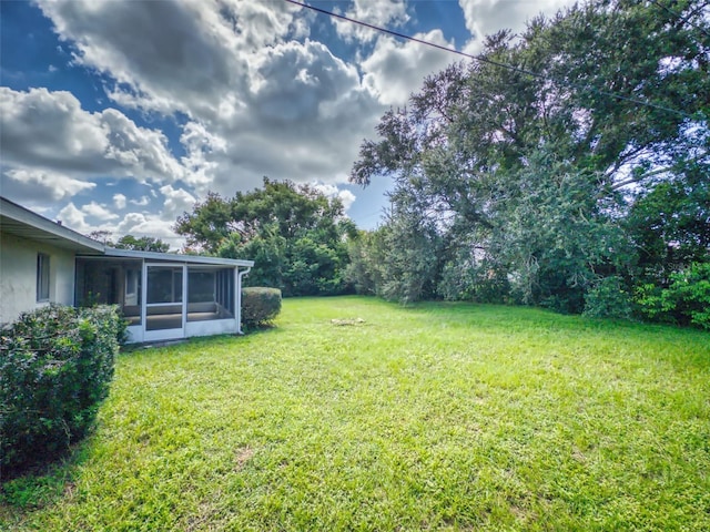 view of yard featuring a sunroom