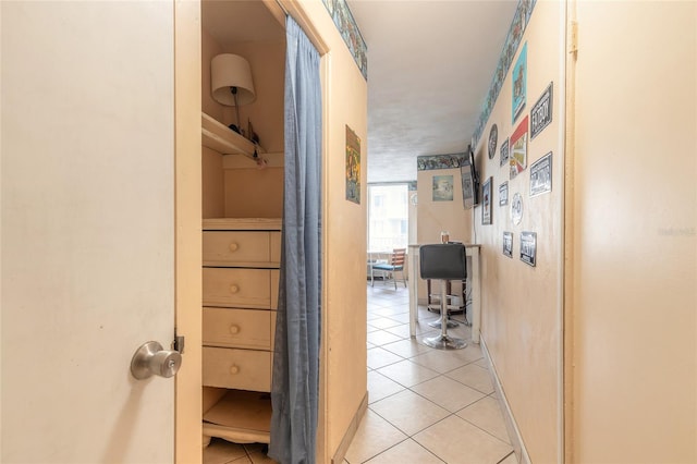 corridor with light tile patterned floors