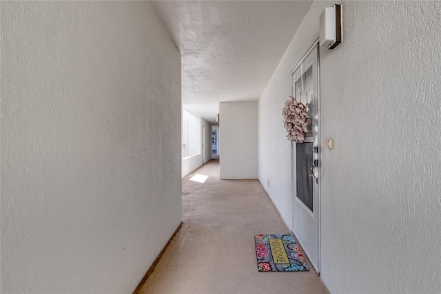 corridor with a textured ceiling