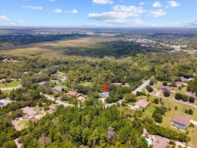 bird's eye view featuring a forest view