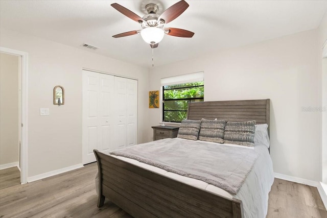 bedroom with ceiling fan, a closet, and light wood-type flooring