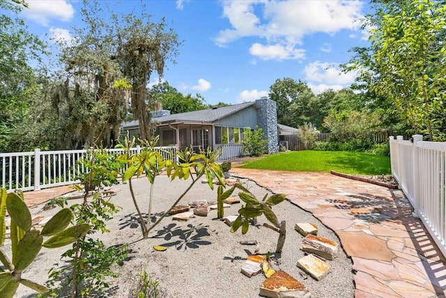 view of patio with a sunroom and a fenced backyard