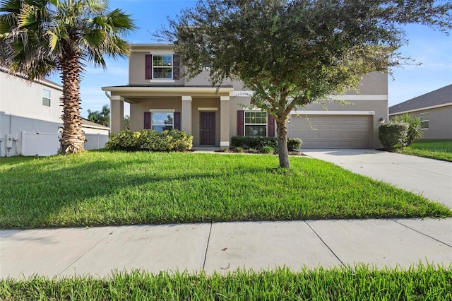 view of front facade with a front lawn and a garage