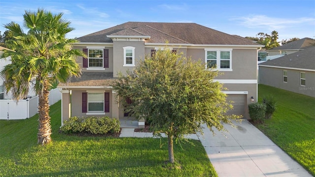 view of front facade with a garage and a front lawn