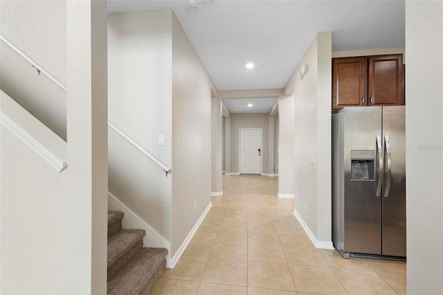 hallway featuring light tile patterned floors