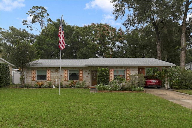 ranch-style home featuring a front yard and a carport