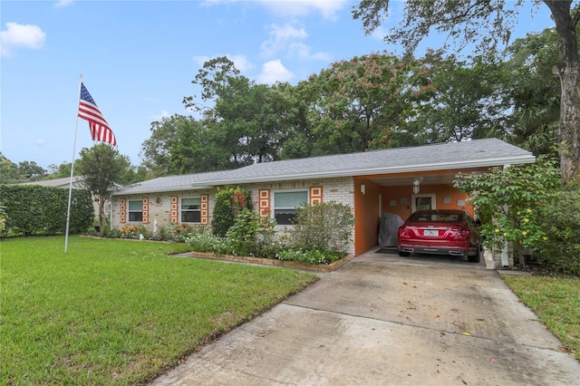 ranch-style house featuring a front lawn and a carport