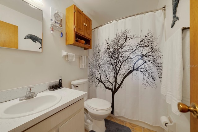 bathroom with walk in shower, vanity, and toilet