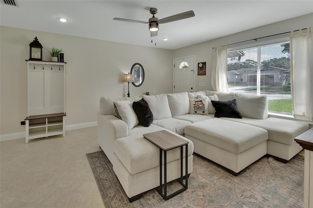 living room with tile patterned flooring and ceiling fan