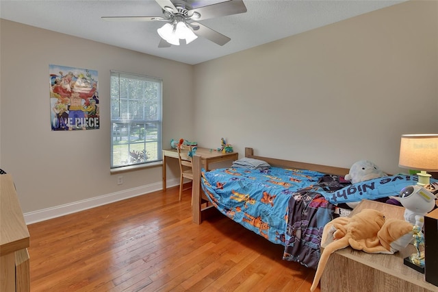 bedroom featuring wood-type flooring and ceiling fan