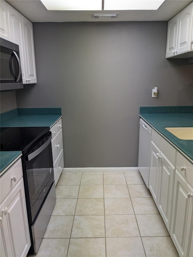 kitchen with white cabinets, sink, light tile patterned floors, black electric range, and dishwasher