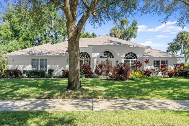 view of front of home with a front lawn