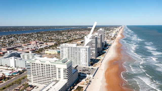 bird's eye view featuring a beach view and a water view