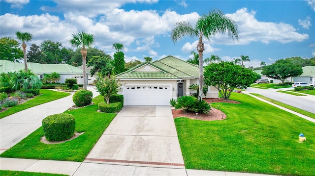 view of front of house featuring a garage and a front lawn