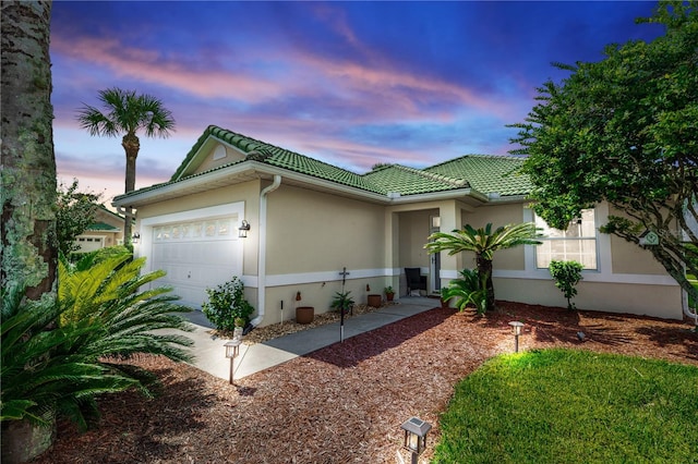 view of front of property featuring a garage