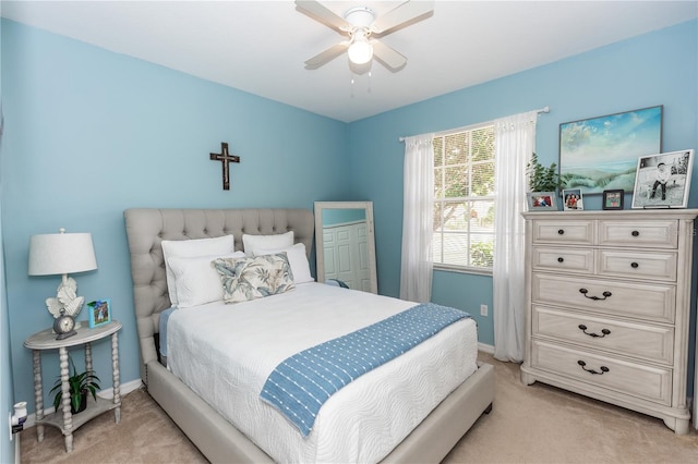 bedroom with ceiling fan and light colored carpet