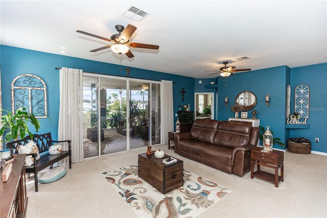 carpeted living room featuring ceiling fan