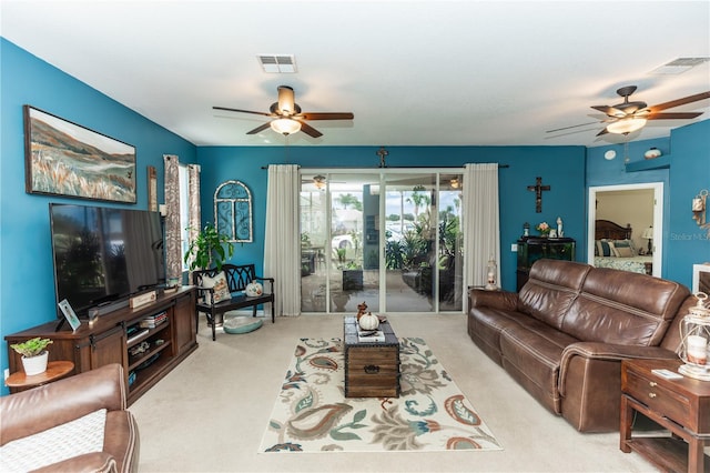 carpeted living room featuring ceiling fan