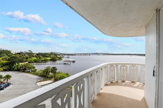 balcony featuring a water view