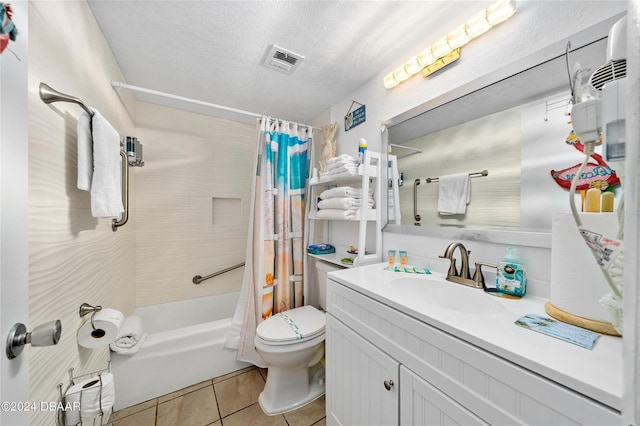 full bathroom with vanity, shower / bath combination with curtain, a textured ceiling, toilet, and tile patterned floors