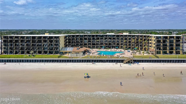 drone / aerial view with a water view and a view of the beach