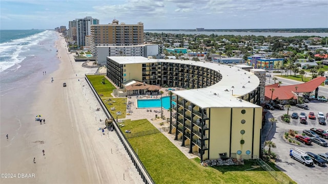 drone / aerial view featuring a view of the beach and a water view