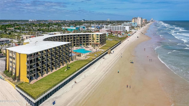 drone / aerial view with a water view and a view of the beach