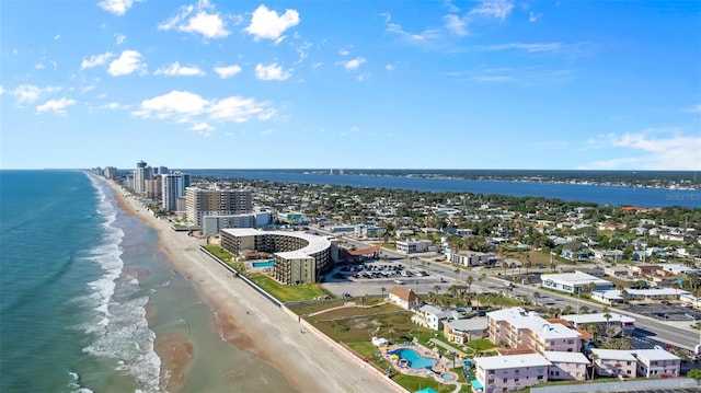 drone / aerial view featuring a view of the beach and a water view