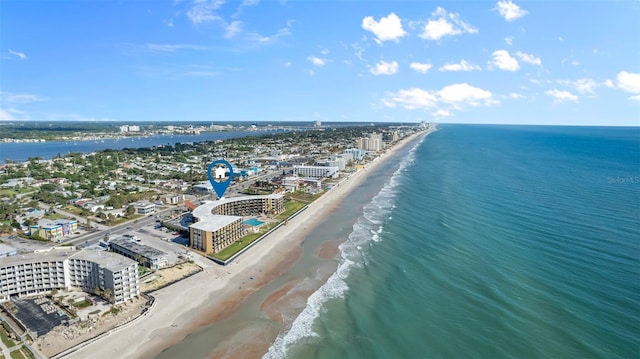 bird's eye view with a water view and a view of the beach