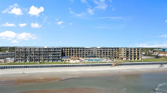 bird's eye view featuring a view of the beach and a water view