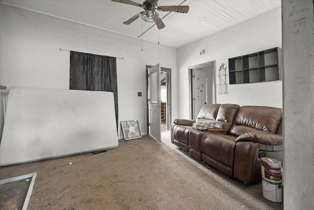 interior space featuring ceiling fan and carpet