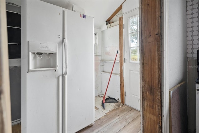 bathroom with wood-type flooring and lofted ceiling