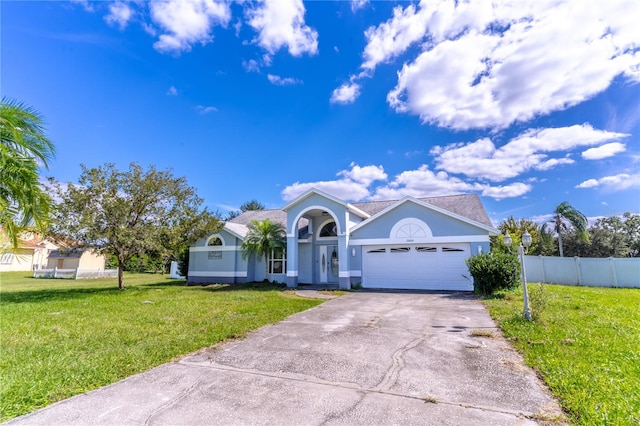 view of front facade featuring a front lawn and a garage