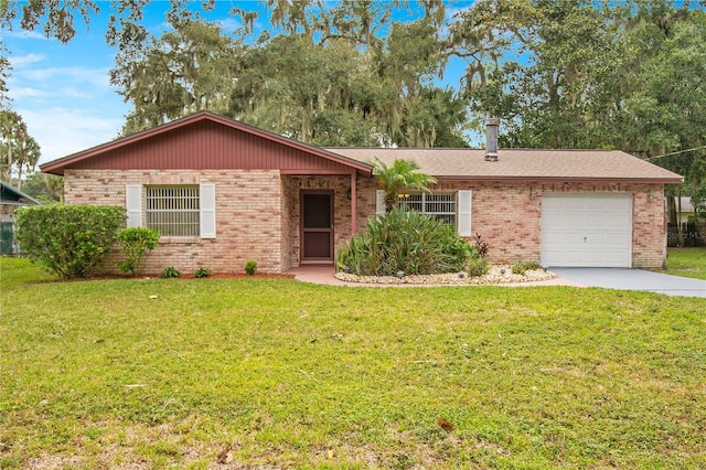 ranch-style home featuring a garage and a front lawn