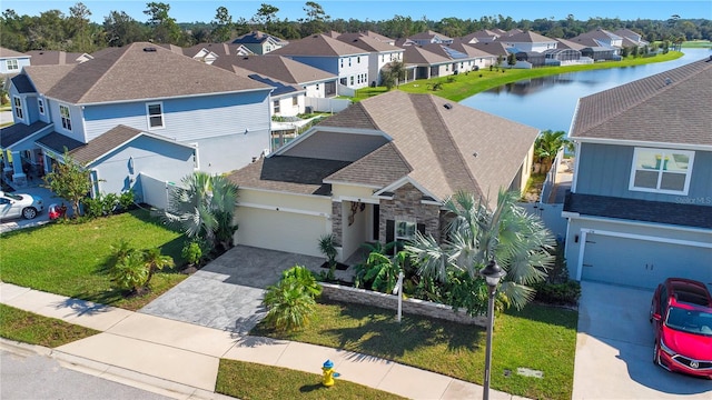 birds eye view of property featuring a water view